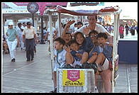 Chair car on the Boardwalk, Atlantic City, New Jersey.