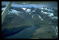 Flying over the mountains near the Milford Sound.  South Island, New Zealand.